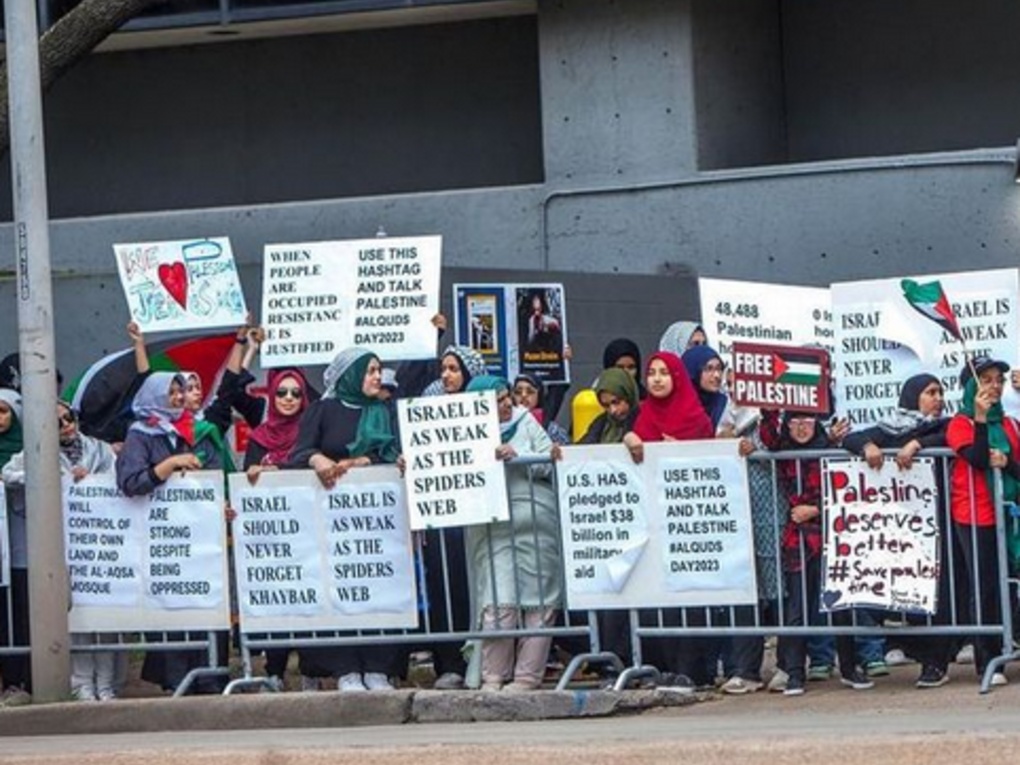 Protesters holding signs
