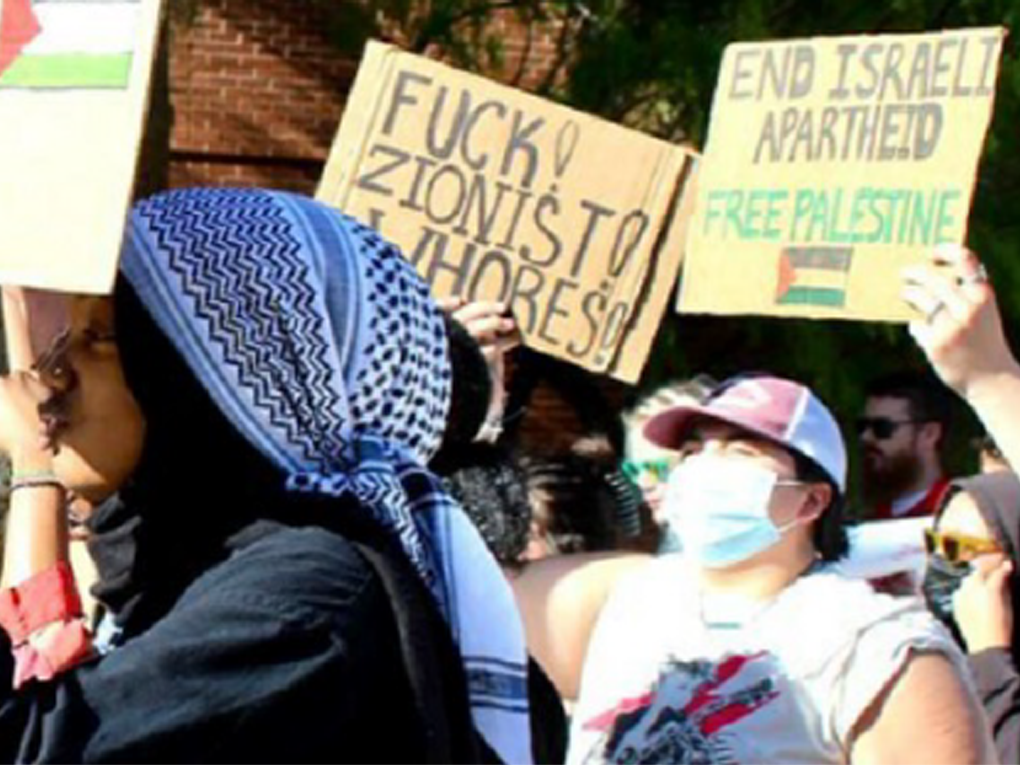 Protesters holding signs