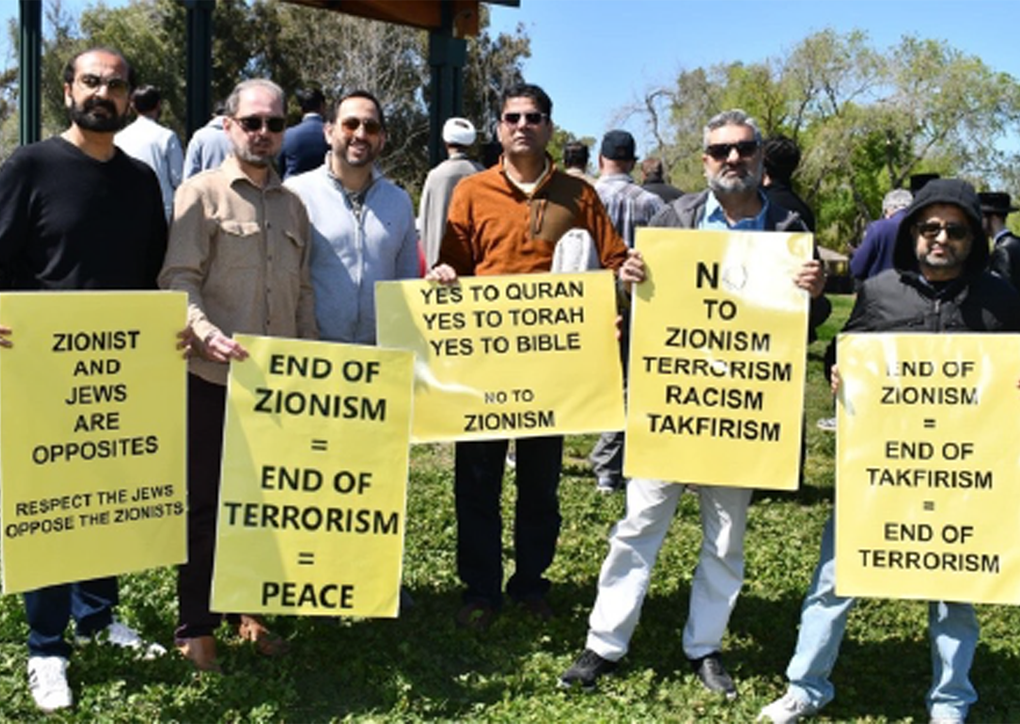 Protesters holding signs