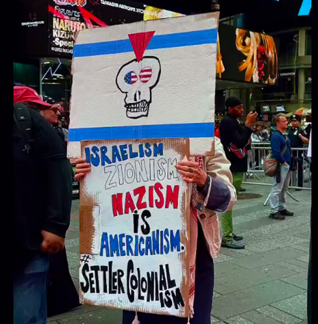 NYC state of antisemitism protest sign
