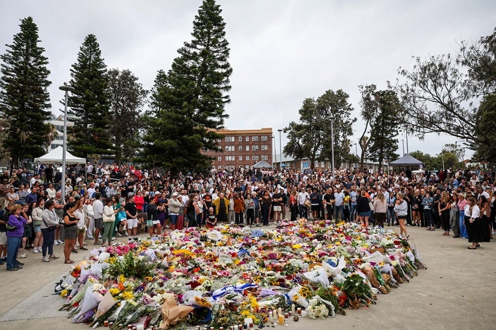 Photo: Mourners gather to lay flowers at Bondi Beach on December 15, 2025, in Sydney, Australia, where 15 were killed and dozens were injured when two attackers opened fire at a Hanukkah celebration. (Izhar Khan/Getty Images)