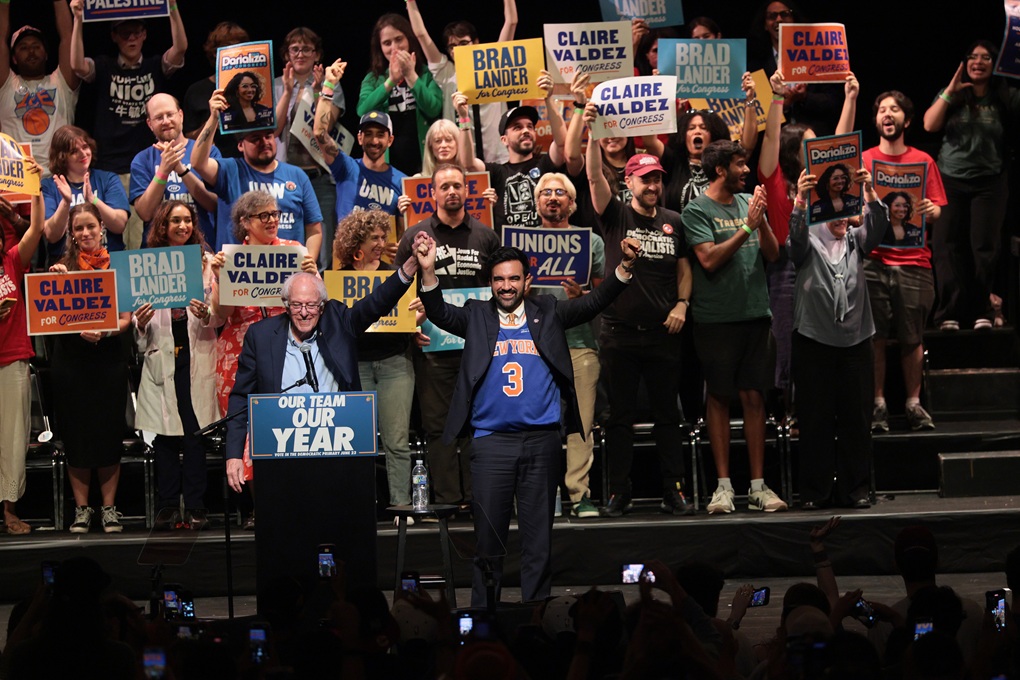 Sen. Bernie Sanders (I-VT) and New York City Mayor Zohran Mamdani raise their hands during a Get Out the Vote (GOTV) rally at Kings Theater on June 18, 2026, in New York City.