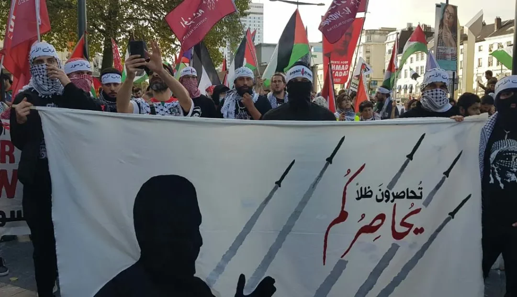 Photo: A Masar Badil rally with a sign in Arabic reading, "you are besieging a shadow that is besieging you." (Masar Badil)