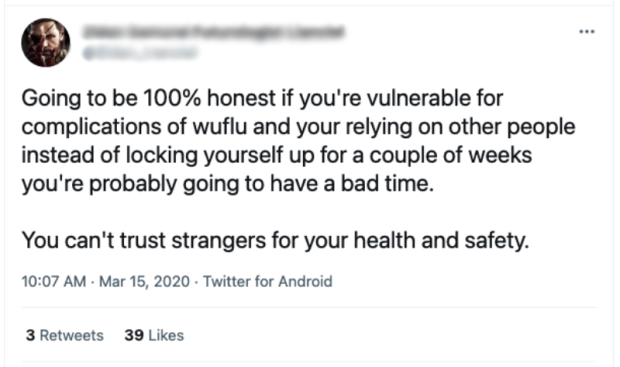 Screenshot of a tweet containing a racial slur ("wuflu").