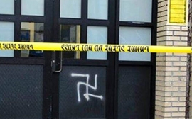 Swastika spray painted on door