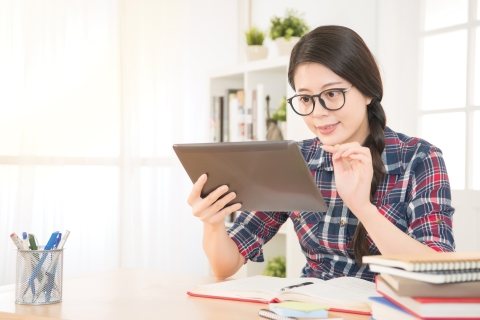 Female student using a tablet computer