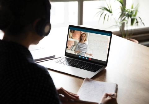 back-view-of-female-have-webcam-lesson-on-laptop