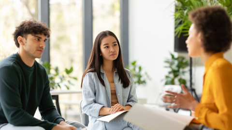 Concentrated multiracial university students in a discussion