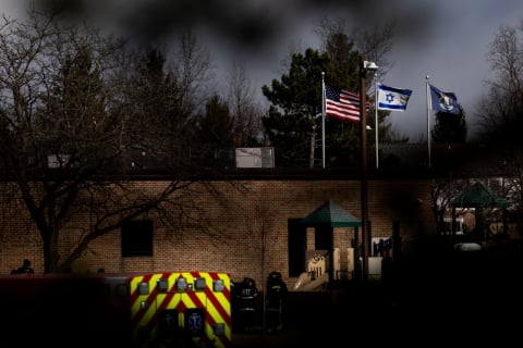 Photo: Law enforcement vehicles are seen in the parking lot of Temple Israel in West Bloomfield, Michigan, following an active shooter on March 12, 2026. According to authorities, a suspect is dead after ramming a vehicle into the Detroit-area synagogue. (Emily Elconin/Getty Images)