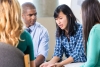 Emotional Asian Woman Talks in a Group