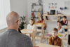 Teacher teaching young students in a classroom