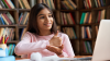 Smiling Indian/Latin school girl who is deaf