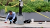Rabbi Mark Rosenberg, director of the Jewish burial society Chesed Shel Emes and law enforcement chief chaplain of Florida, cleans blood off the sidewalk at the shooting location outside of the Capital Jewish Museum on May 22, 2025, in Washington, DC.