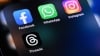 An illustrative photo of the Facebook, WhatsApp, Instagram and Threads apps by Meta Platforms on an iPhone, August 2023